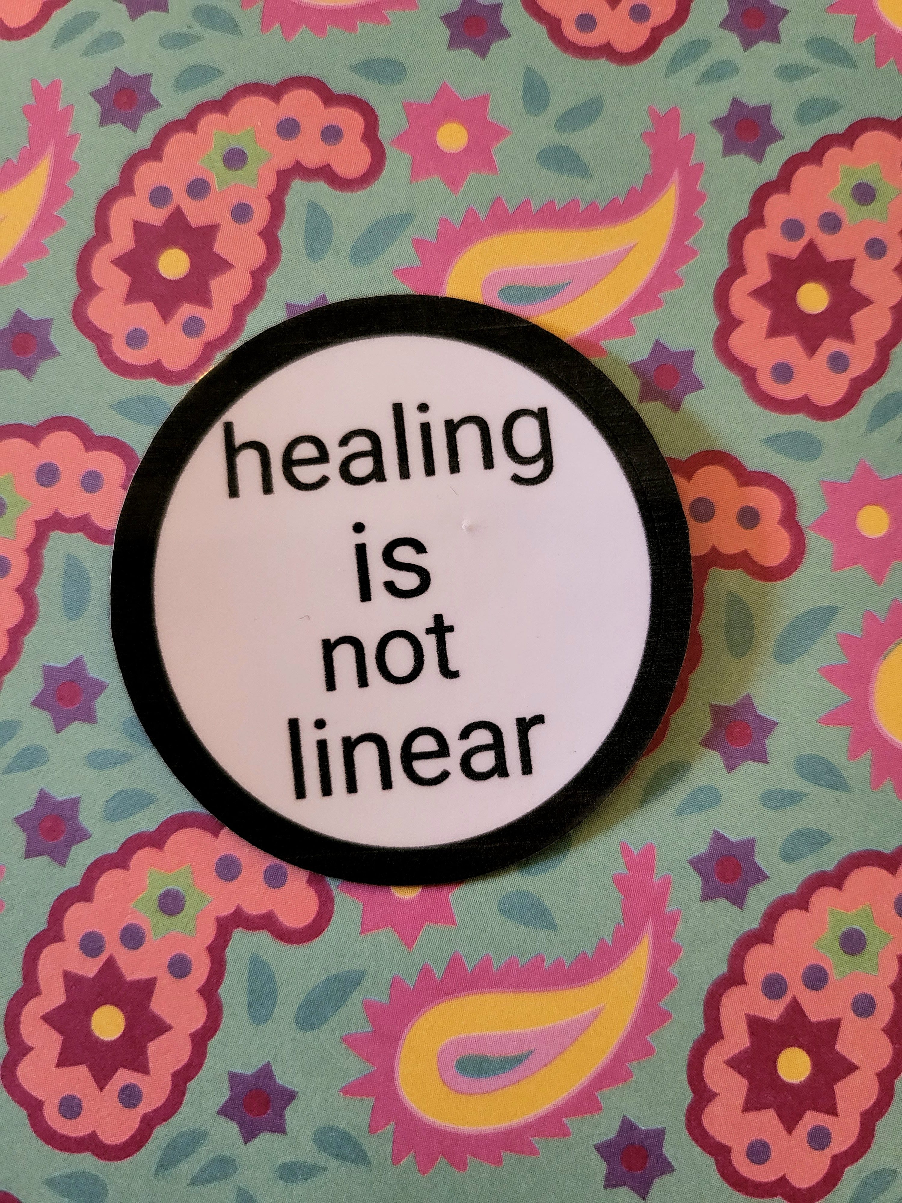 Sticker by KaspersKreations with text healing is not linear